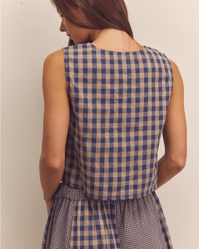 Navy gingham check button down top from Amente paired with its matching panel skirt at Clad, a sustainable clothing store in Asheville, NC.