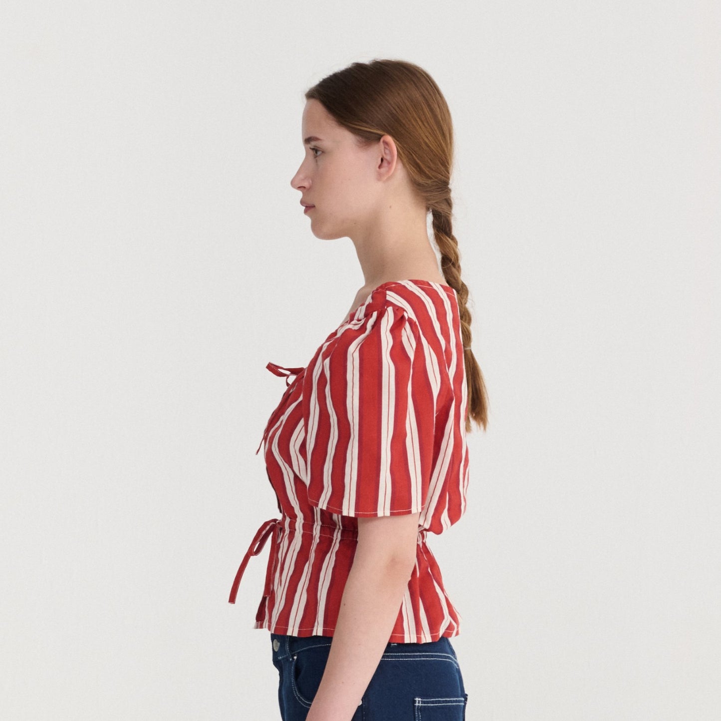 Striped peplum top button-down and te detail