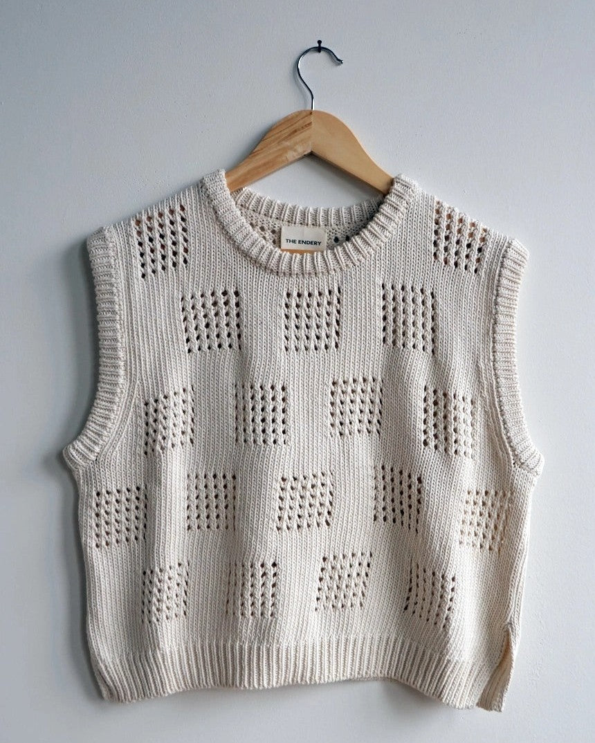 The Endery knit eyelet Katt sweater vest in beige shell