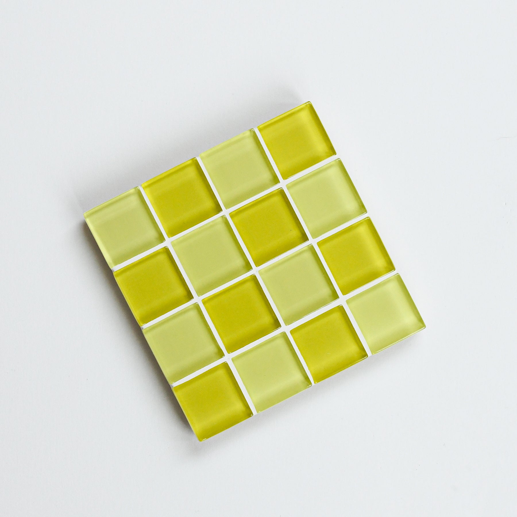 Vibrant, colorful glass tile coaster by Subtle Art Studios in Banana Frosting with chartreuse yellow green and butter tiles.