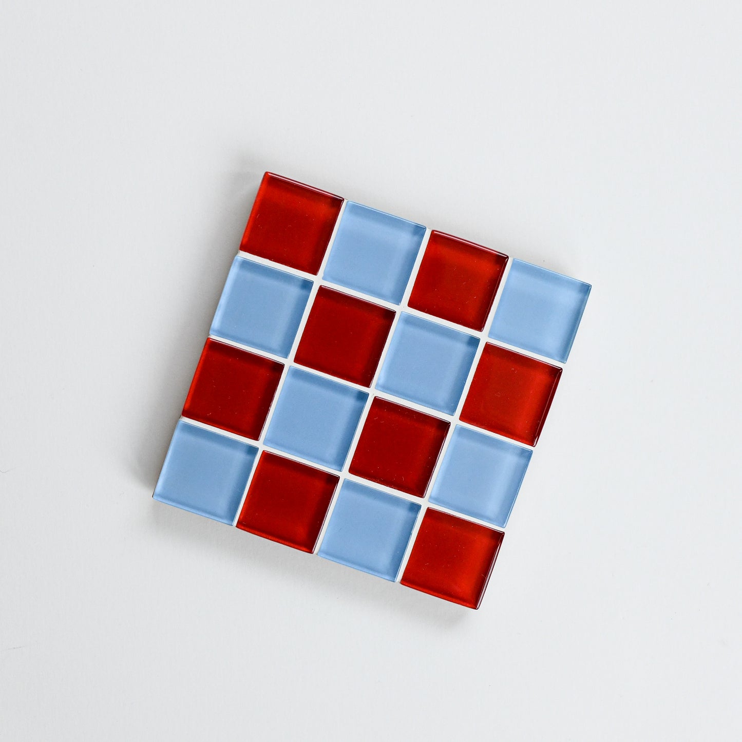 Vibrant, colorful glass tile coaster by Subtle Art Studios in Love Letter with red and cornflower light blue tiles.