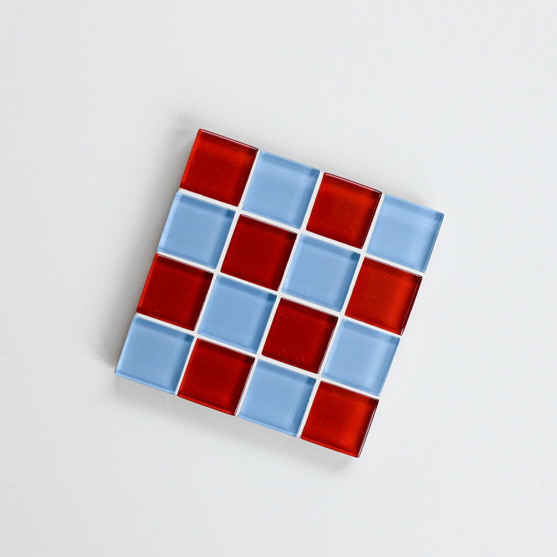 Vibrant, colorful glass tile coaster by Subtle Art Studios in Love Letter with red and cornflower light blue tiles.