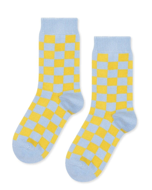 Checkered blue and chartreuse socks from Hansel from Basel at Clad, a sustainable clothing boutique in Asheville, NC