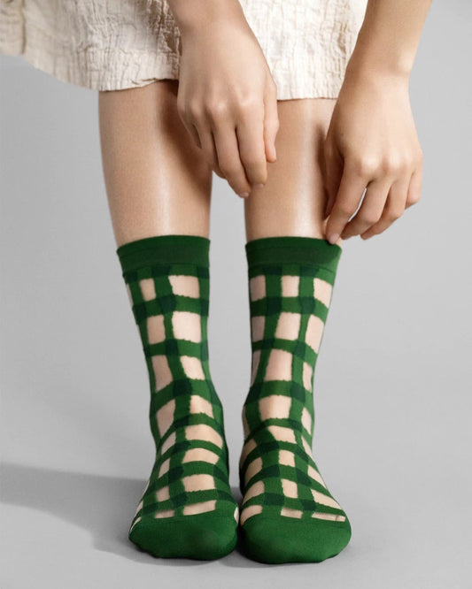 Green google sheer ankle sock in gingham from Hansel from Basel at Clad, a sustainable clothing boutique in Asheville, North Carolina.