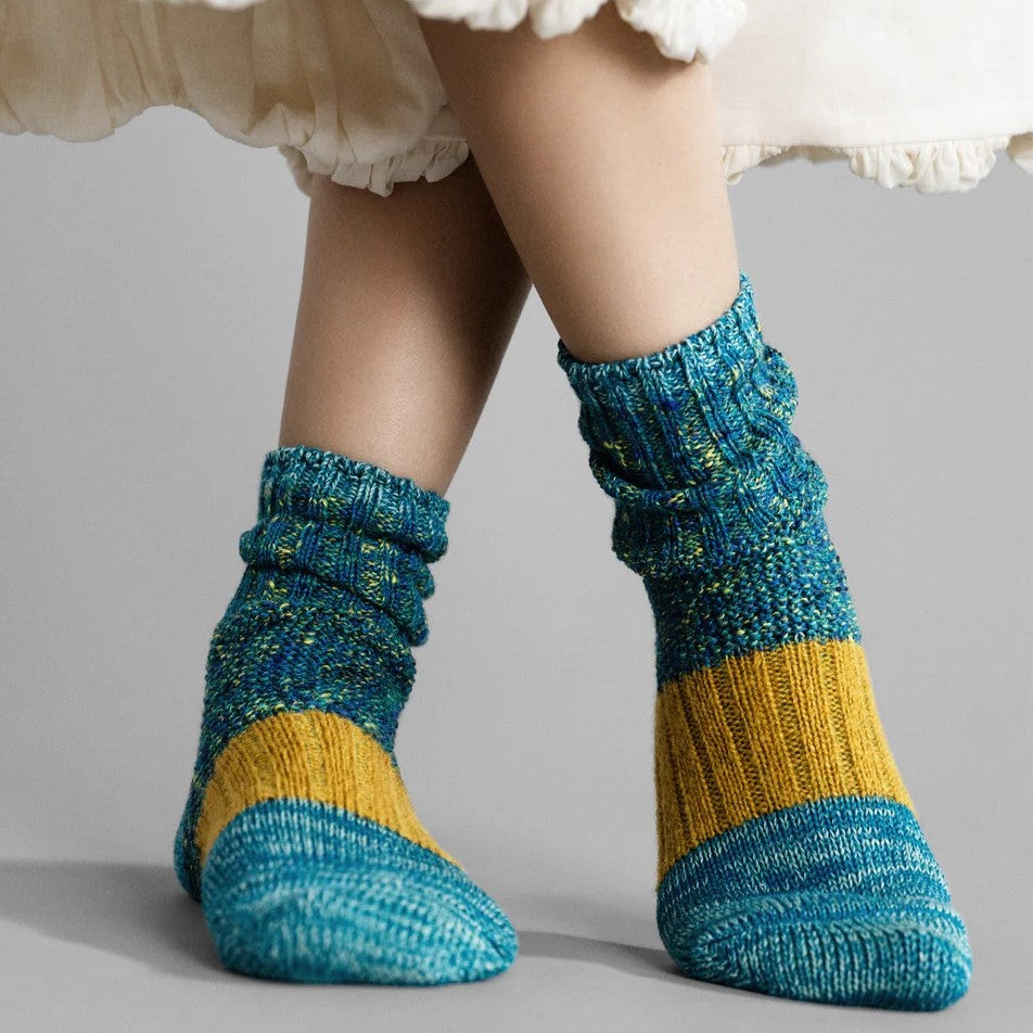 Pixie dapple crew socks in ocean teal blue with citron mustard yellow from Hansel from Basel at Clad, a sustainable clothing store in Asheville, NC.