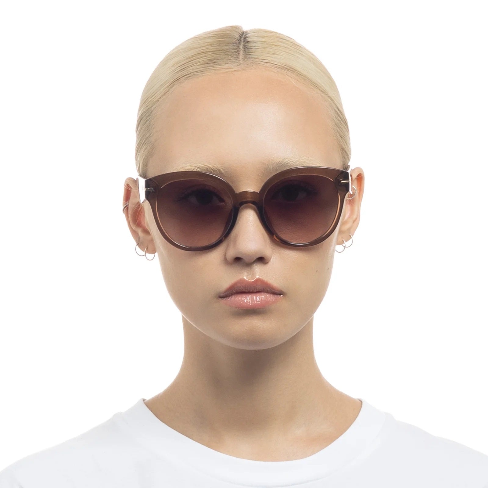 Capacious hocolate sunglasses from Le Specs at Clad, a sustainable clothing store in Asheville, NC