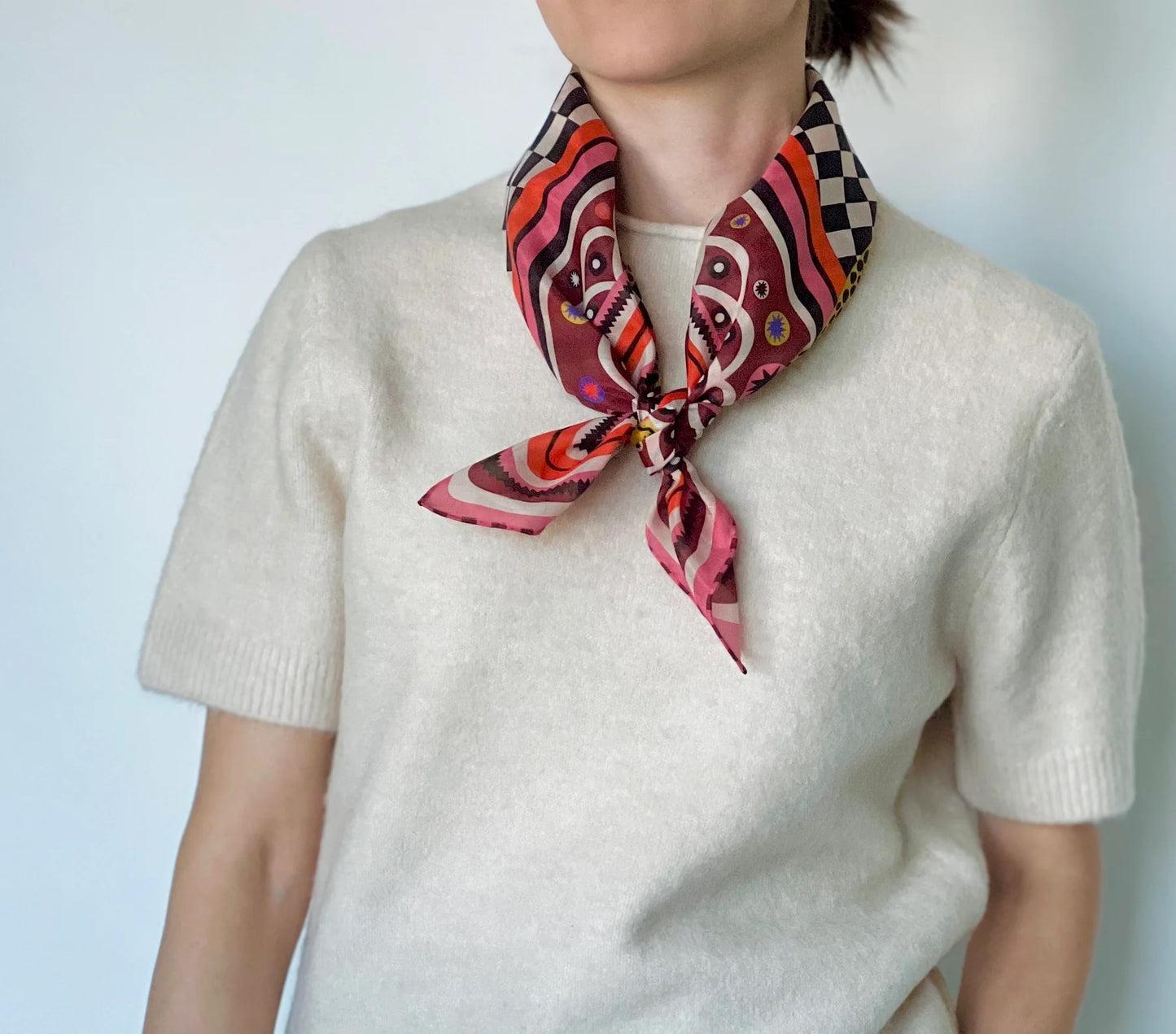 Silk and cotton cheetah print bandana with black and white checker board at Clad, a sustainable clothing shop in Asheville, NC.