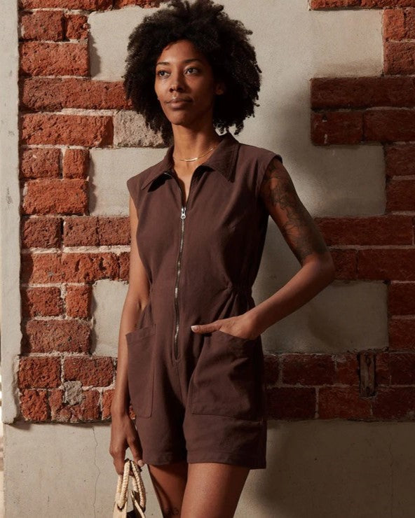 Chocolate brown tank utility romper suit with a zipper front and large pockets. Made by Noble. Find it at Clad, a sustainable clothing boutique in Asheville, North Carolina.