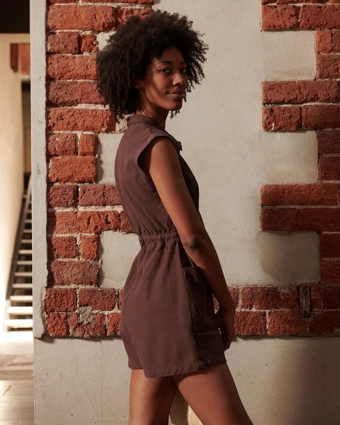 Chocolate brown tank utility romper suit with a zipper front and large pockets. Made by Noble. Find it at Clad, a sustainable clothing shop boutique in Asheville, North Carolina.