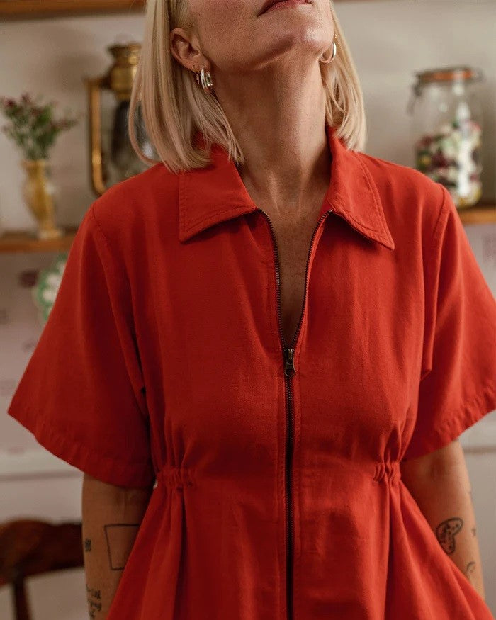 Noble utility dress in paprika orange at Clad, a sustainable clothing store in Asheville, NC