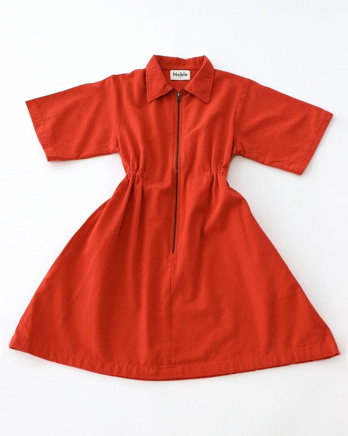 Noble utility dress in paprika orange at Clad, a sustainable clothing store in Asheville, NC