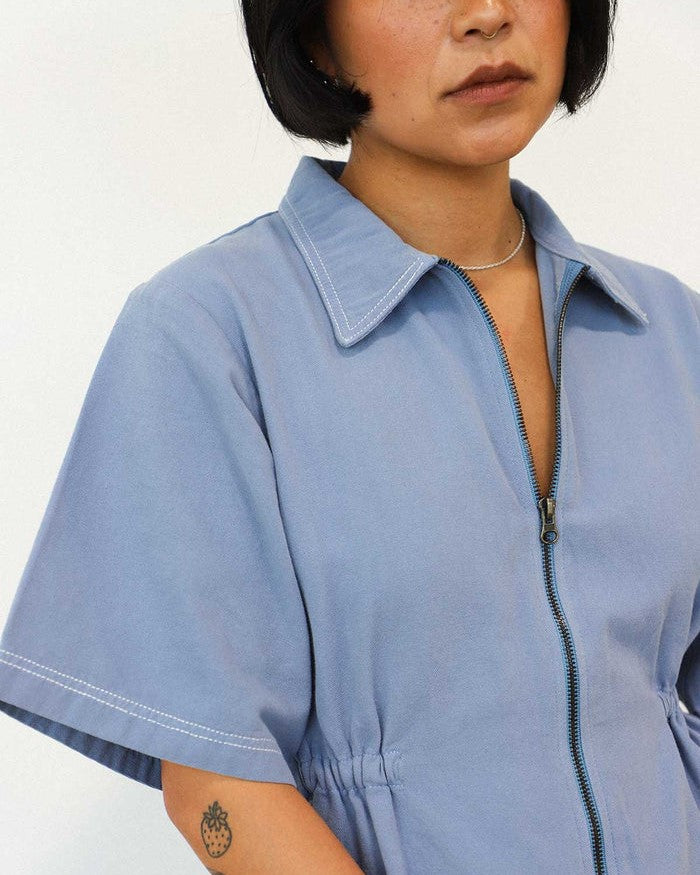 Utility dress with contrast stitch in pebble blue by Noble at Clad, a sustainable clothing store in Asheville, NC
