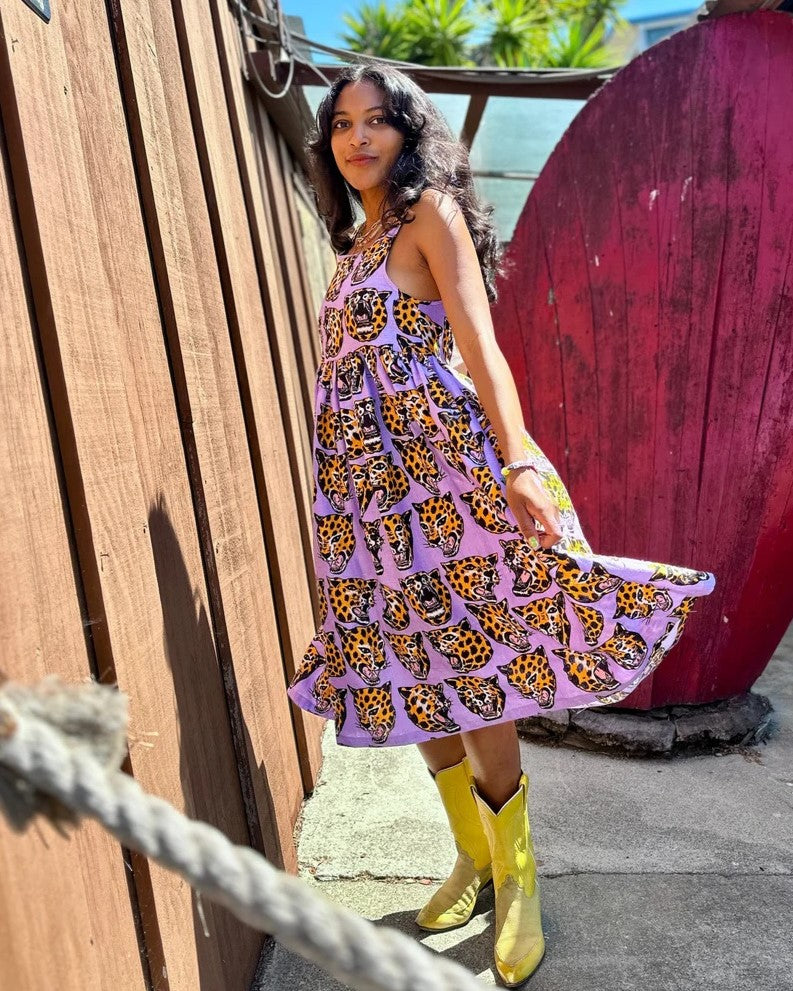 Nooworks linen Naomi dress in cheetah head paired with bright yellow cowboy boots at Clad, a sustainable clothing store in Asheville, NC