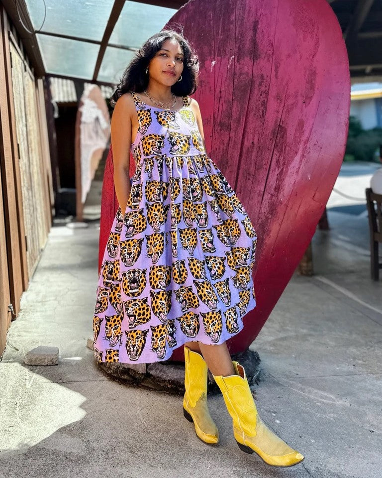 Nooworks linen Naomi dress in cheetah head paired with bright yellow cowboy boots at Clad, a sustainable clothing store in Asheville, NC