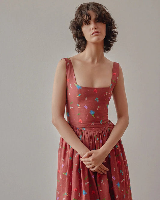 Dani floral dress in copper terracotta by Oh Seven Days at Clad, a sustainable clothing boutique in Asheville, NC