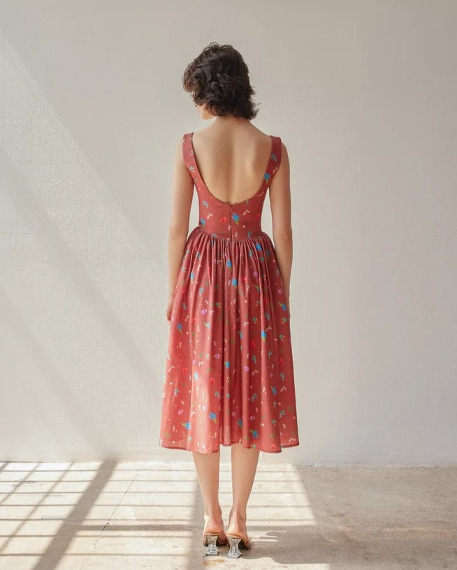 Dani floral dress in copper terracotta by Oh Seven Days at Clad, a sustainable clothing boutique in Asheville, NC