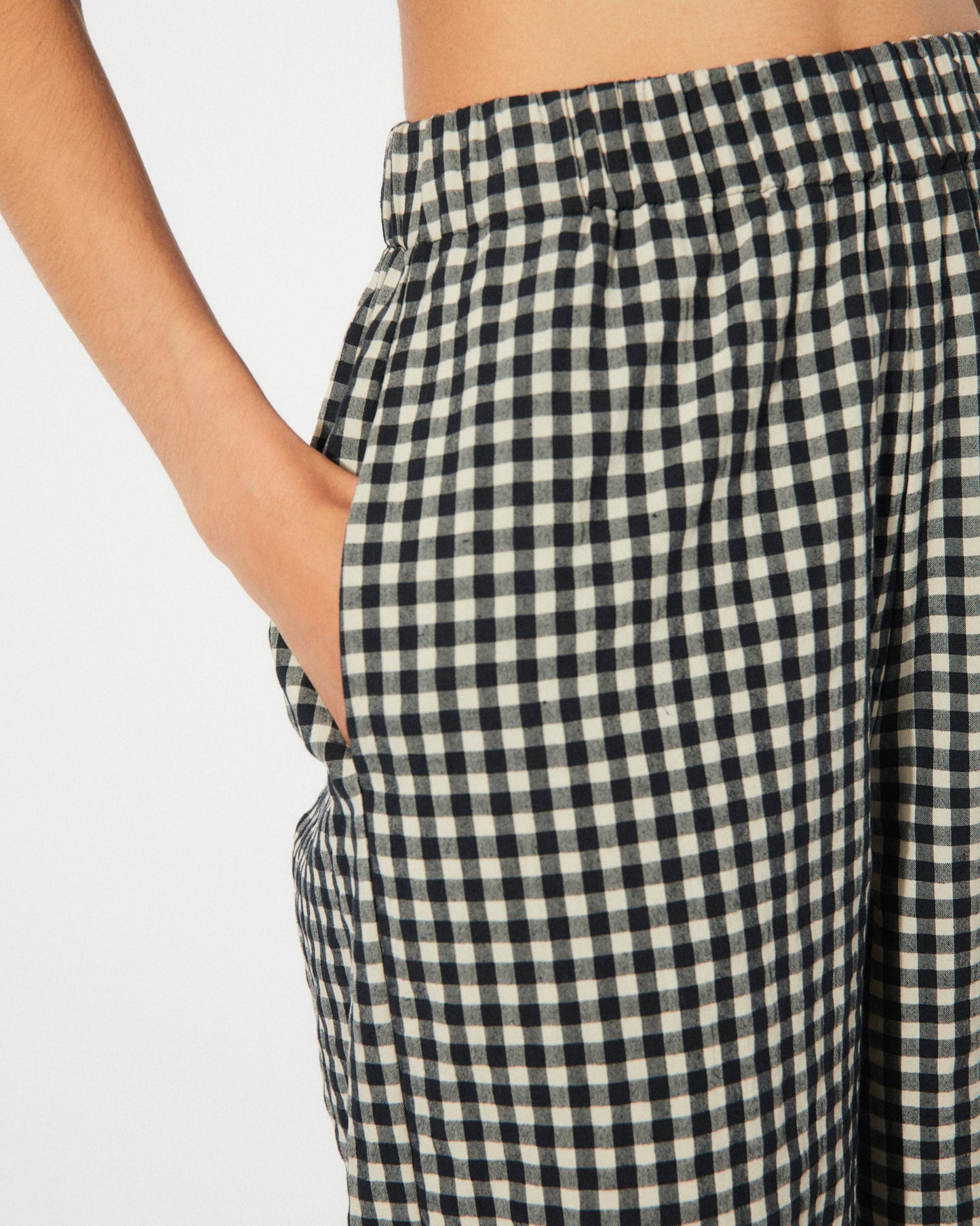 Black gingham checkered cep pants by Rita Row with an elastic high waist at Clad, a sustainable clothing boutique in Asheville, NC