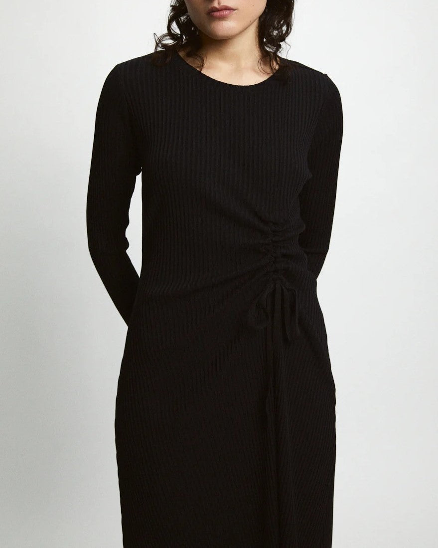 Black ribbed knit Evans Dress from Rita Row paired with black leather boots at Clad, a sustainable clothing boutique in Asheville, NC.