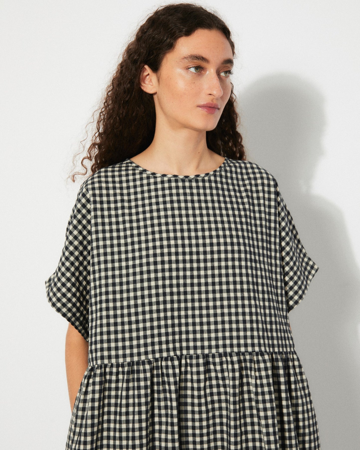 Black gingham checkered Lustre Dress by Rita Row at Clad, a sustainable clothing boutique in Asheville, NC