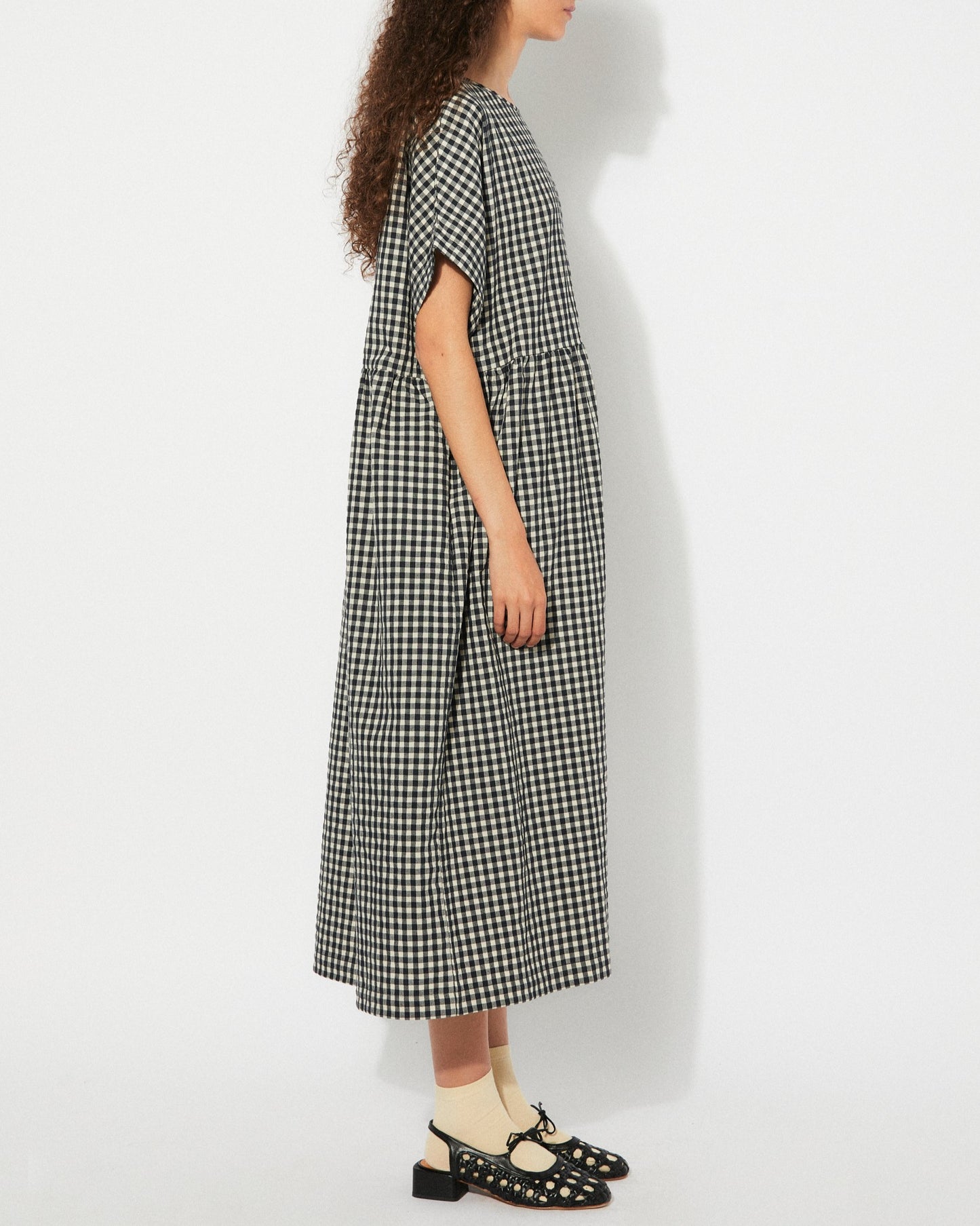 Black gingham checkered Lustre Dress by Rita Row at Clad, a sustainable clothing boutique in Asheville, NC