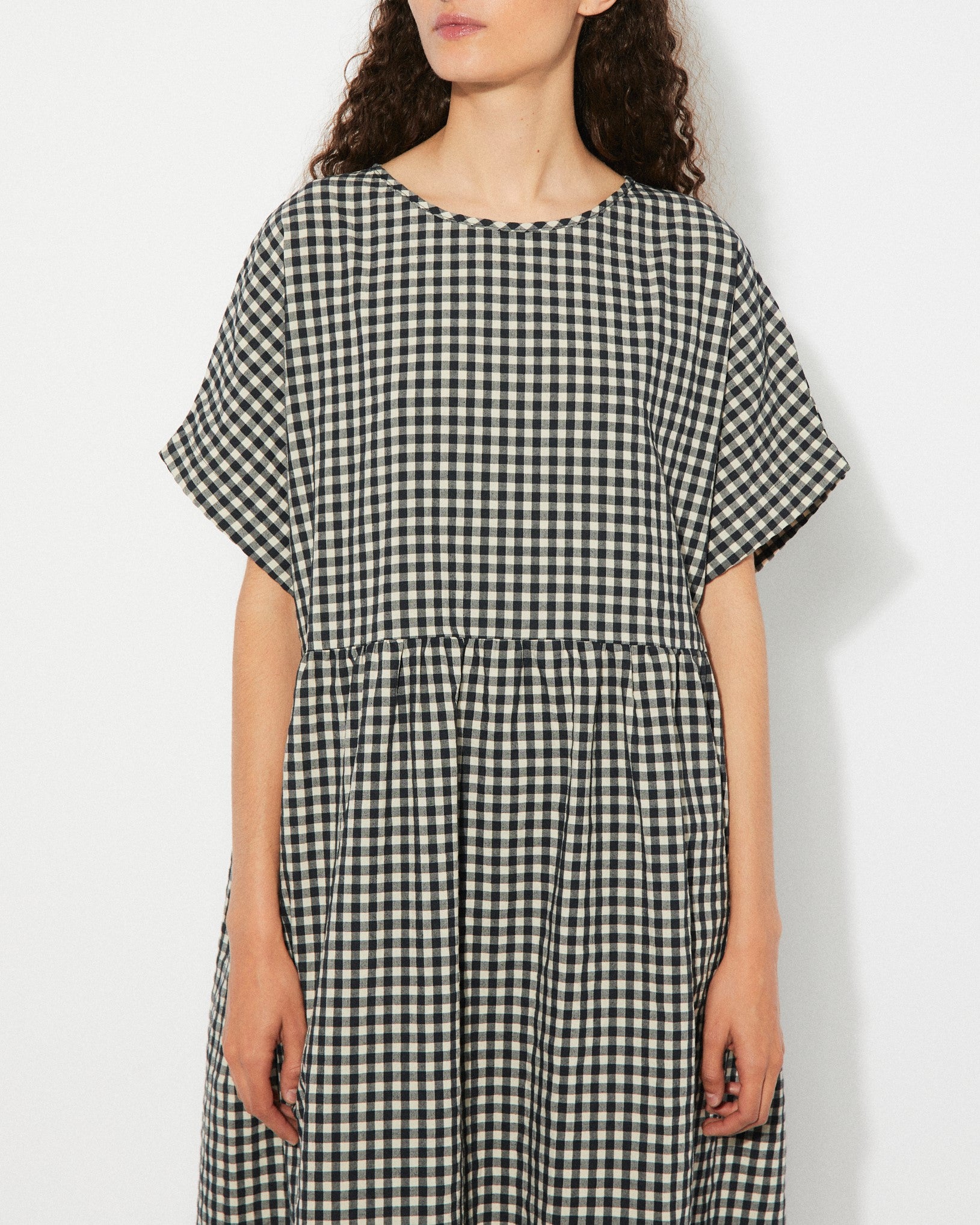 Black gingham checkered Lustre Dress by Rita Row at Clad, a sustainable clothing boutique in Asheville, NC