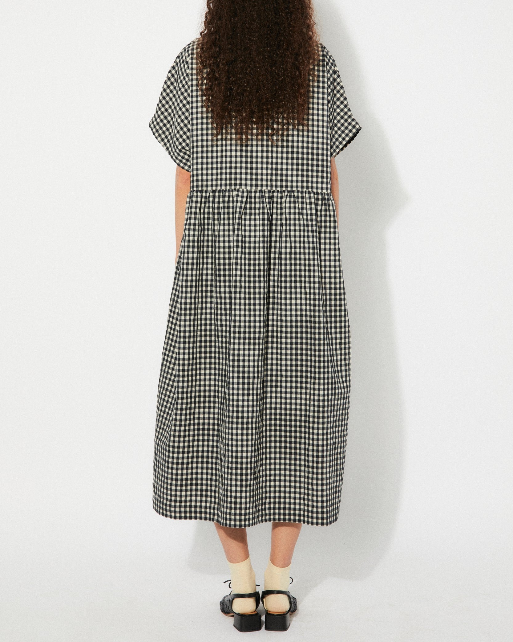 Black gingham checkered Lustre Dress by Rita Row at Clad, a sustainable clothing boutique in Asheville, NC