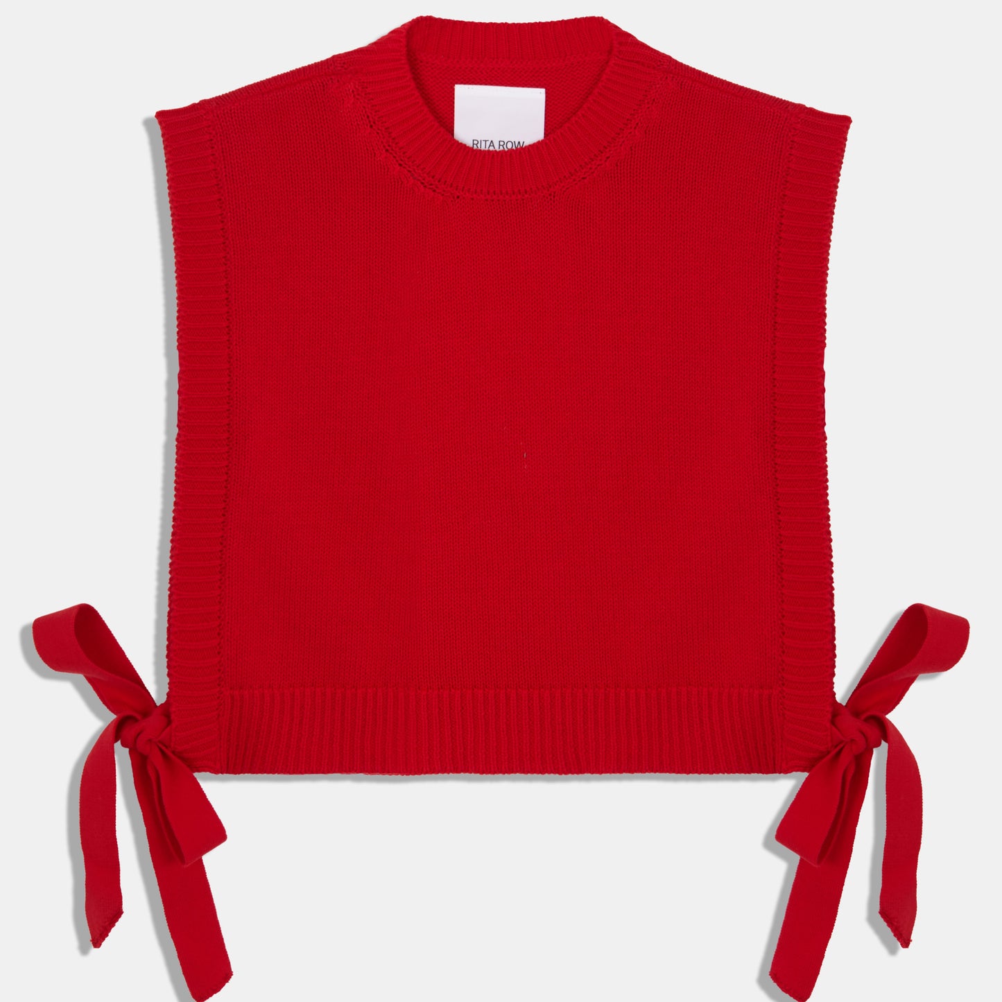 Rita Row red pilea sweater vest with open sides and bow ties on either side at Clad, a sustainable clothing store in Asheville, NC
