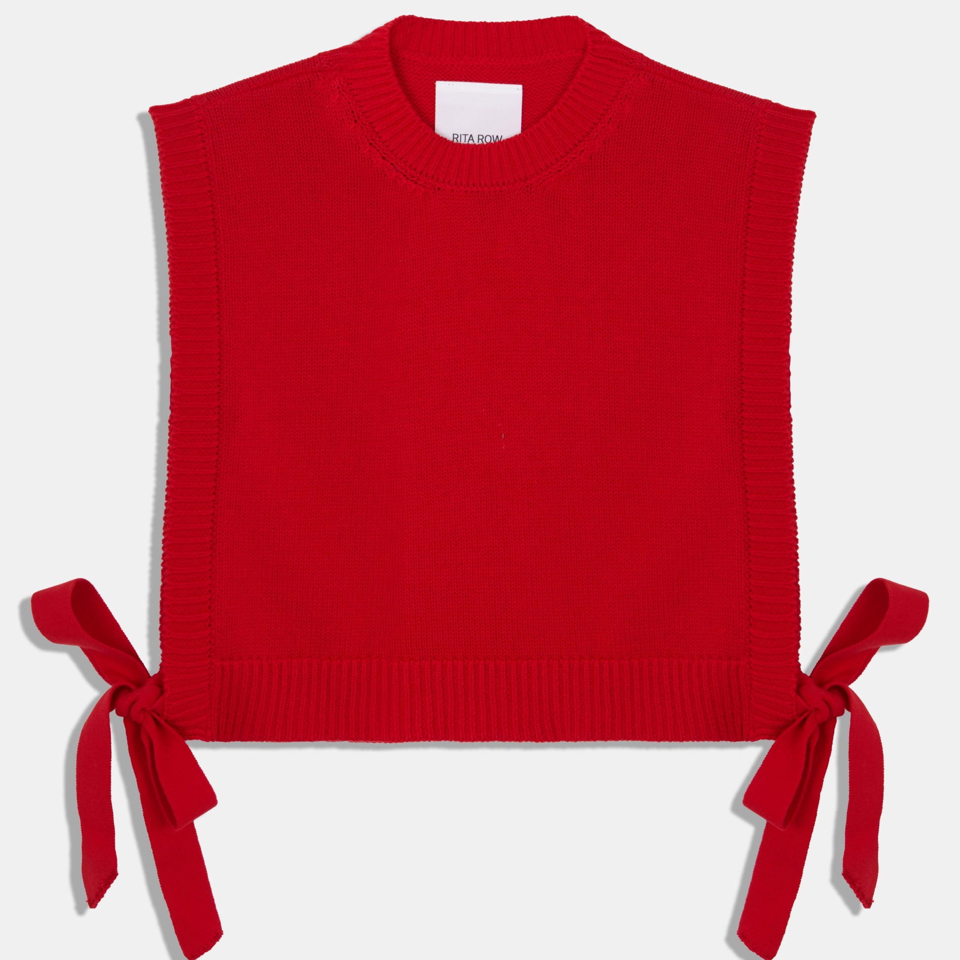 Rita Row red pilea sweater vest with open sides and bow ties on either side at Clad, a sustainable clothing store in Asheville, NC