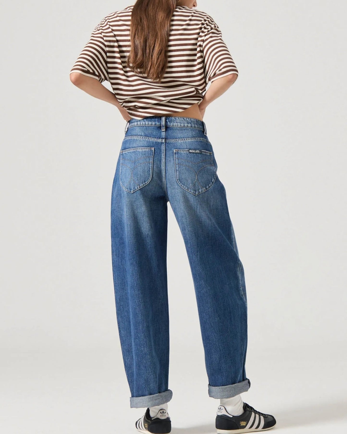 Rolla's Gigi barrel jeans in Paris Texas turn-up, paired with sneakers and a striped boxy tee.