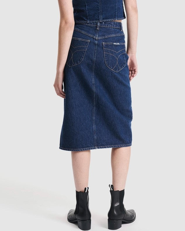 High-wasited denim skirt with button-down front by Rolla's. Paired with a matching denim vest and black ankle boots.