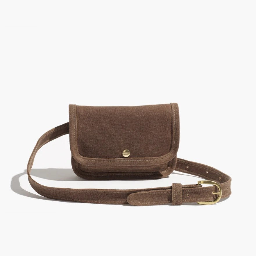 Belt bag by Small Lot Co in brush brown with a metal snap, adjustable waist. Fanny pack style made from cotton canvas.