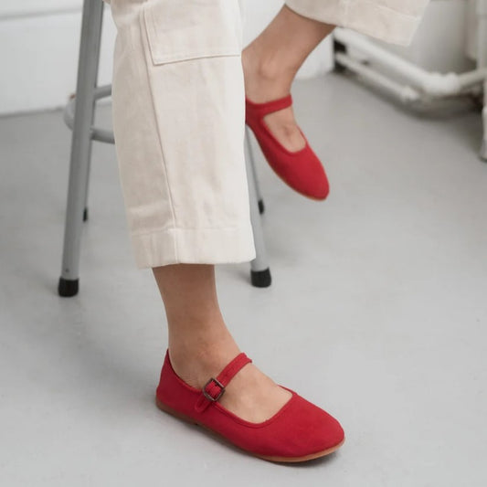 Classic red mary janes with natural rubber soles made by Small Lot Co at Clad, a sustainable clothing boutique in Asheville, NC