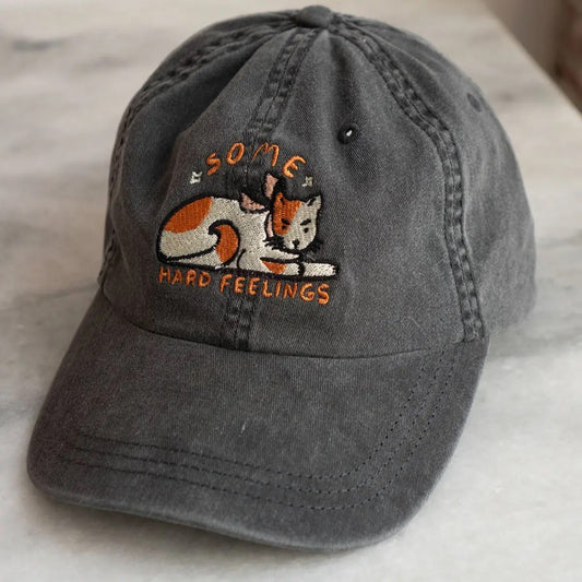 Some Hard Feelings cat baseball cap in worn charcoal from Stay Home Club at Clad, a sustainable clothing store in Asheville, NC