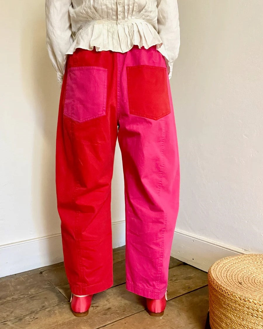 Verity & Daughters Cotton Barrel Elastic Waist Pants with pink and red colorblock at Clad, a sustainable clothing store in Asheville , NC. Contrast back pockets.