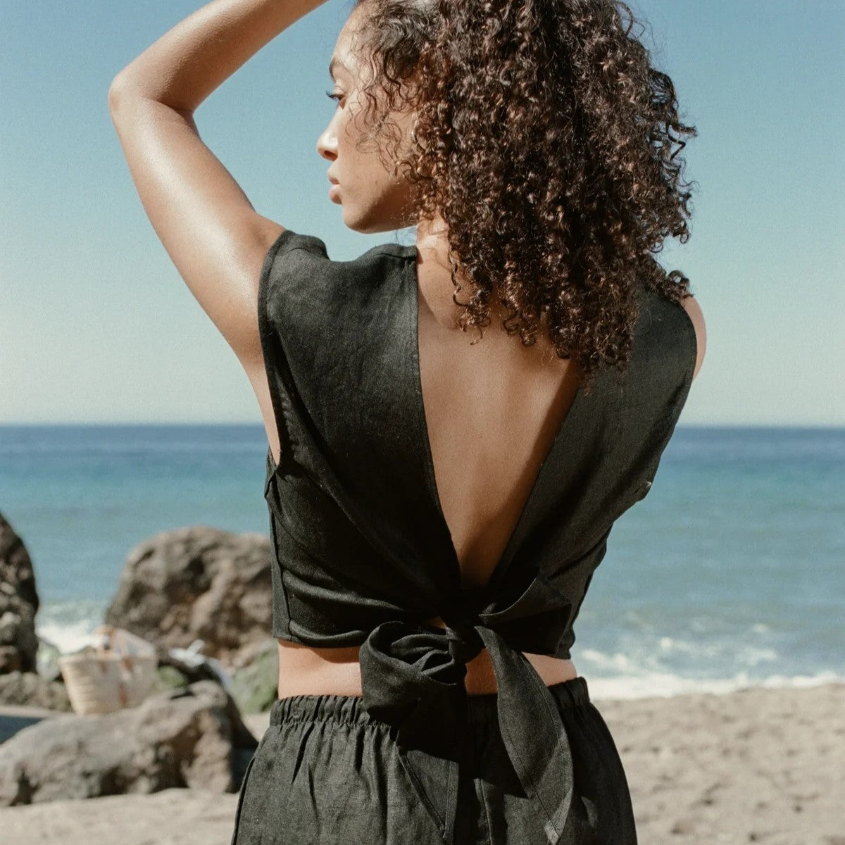 A reversible linen wrap top in black.