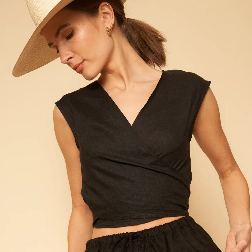 A reversible linen wrap top in black.