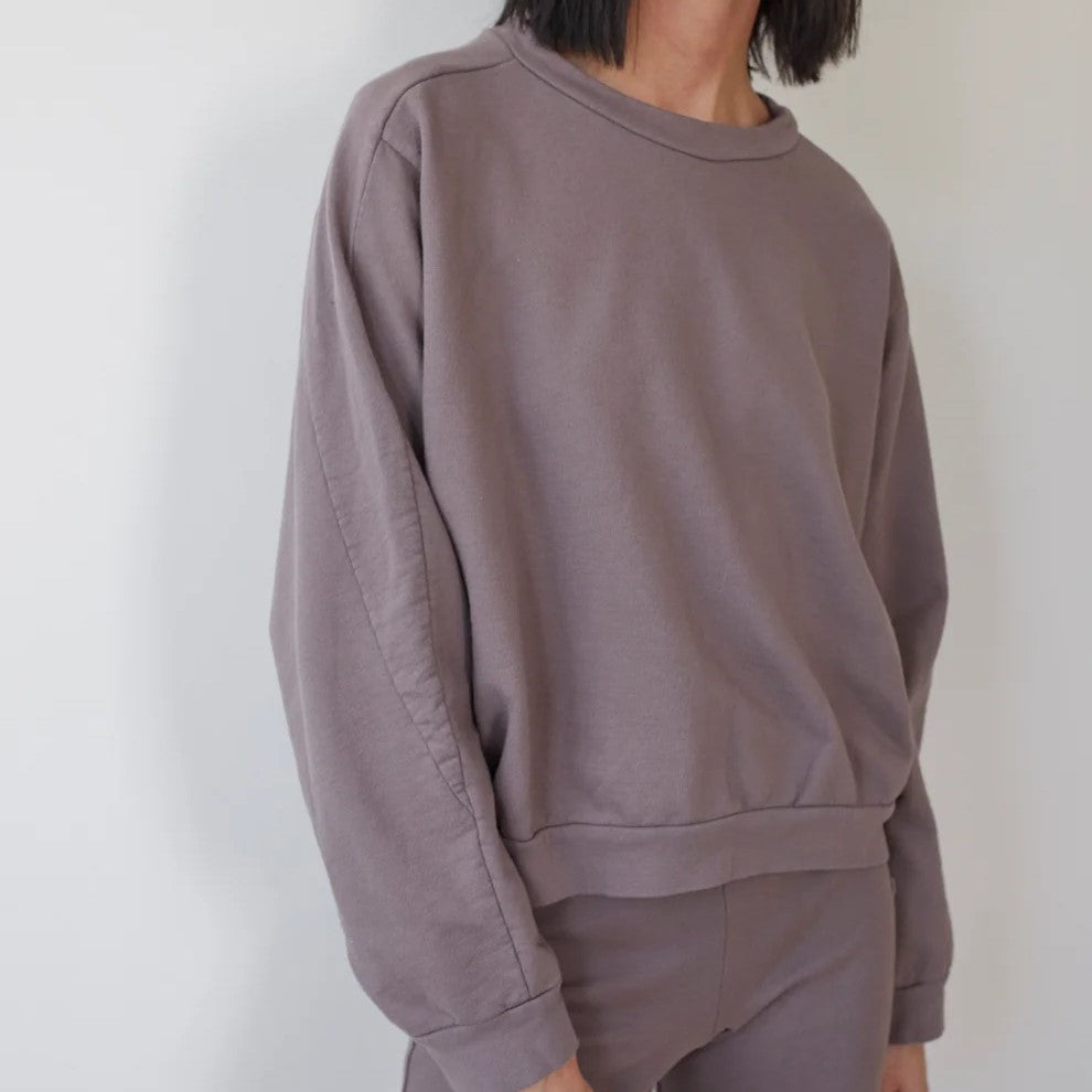 The Easy Summer Sweatshirt from sustainable brand Wol Hide in cotton with lightweight French terry. Wide hem, crew neck, mushroom light brown taupe hue.