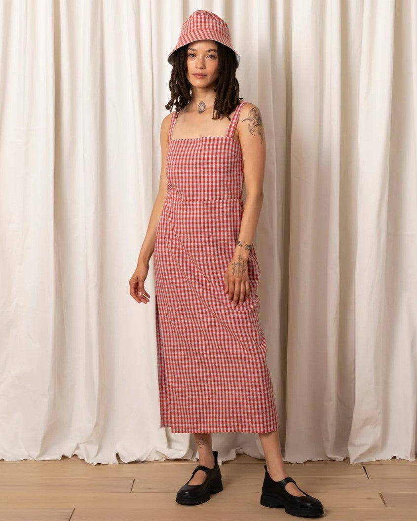 Poppy and ice gingham Column Dress by Ali Golden. Thick adjustable straps and large side slit. Paired with chunky black strap loafers and a matching bucket hat.