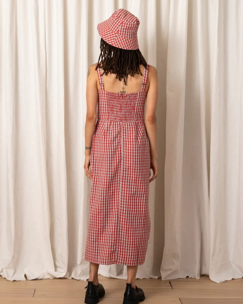 Poppy and ice gingham Column Dress by Ali Golden. Thick adjustable straps and large side slit. Paired with chunky black strap loafers and a matching bucket hat.