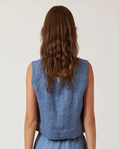 Denim blue boxy linen crop top with button-down side. Paired with matching drawstring pants.