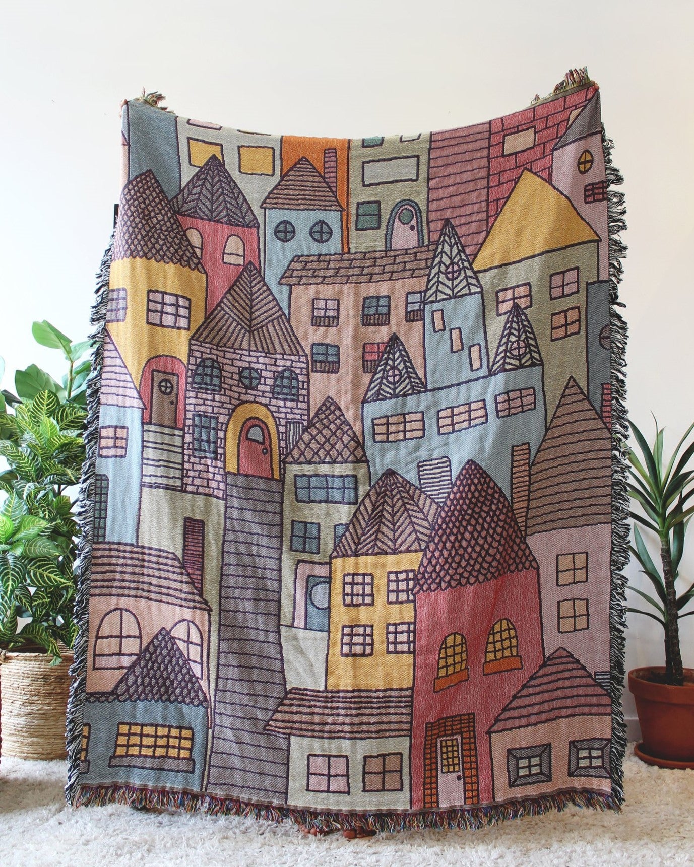 Hillside Village Tapestry Blanket with houses and homes. Reversible with a fringe border.