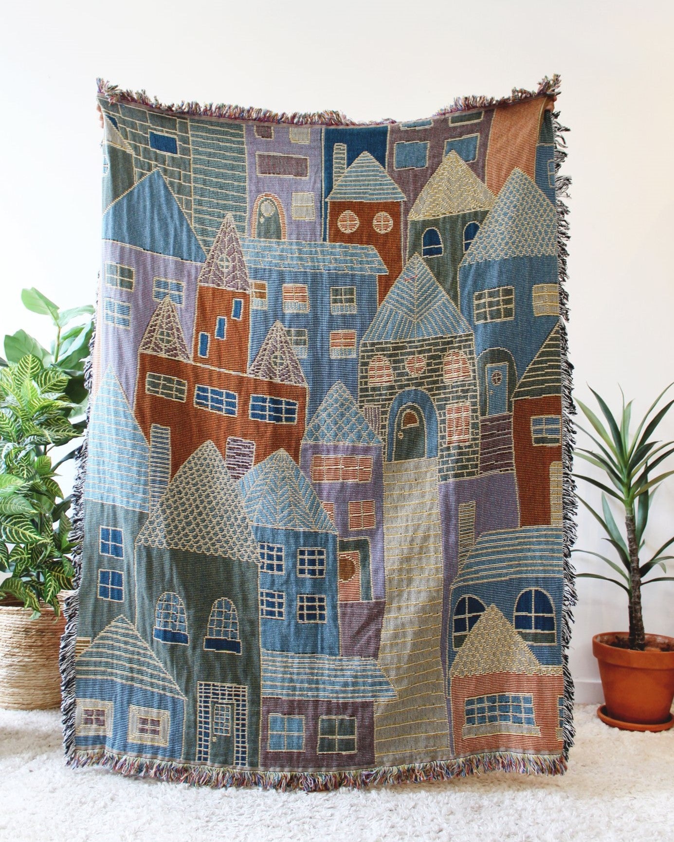 Hillside Village Tapestry Blanket with houses and homes. Reversible with a fringe border.