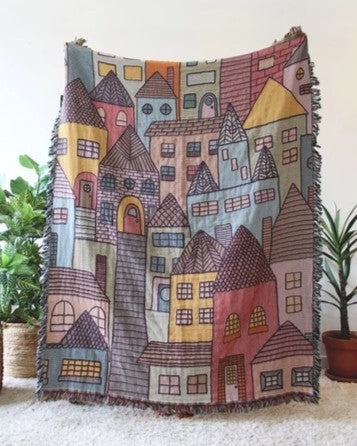 Hillside Village Tapestry Blanket with houses and homes. Reversible with a fringe border.