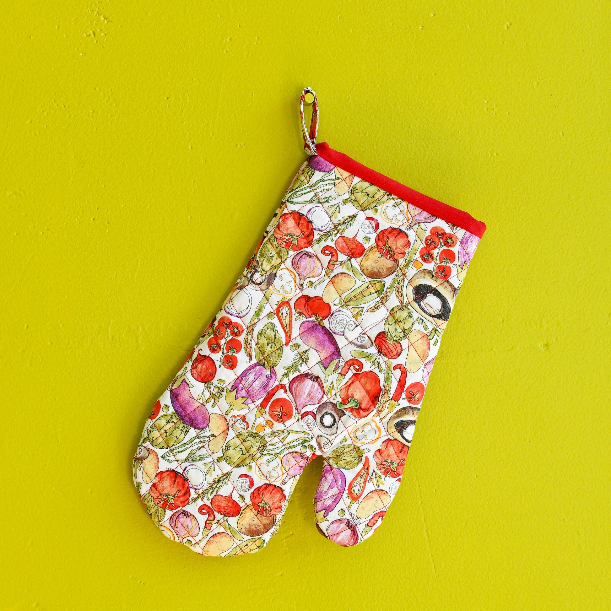 Clad oven mitt holiday special edition with fruit sand vegetables and loop holder