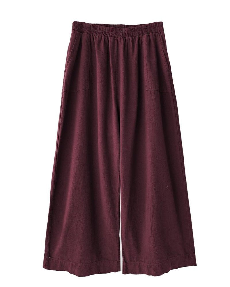 Curator atlas pant in burgundy paired with clogs and a quilted jacket