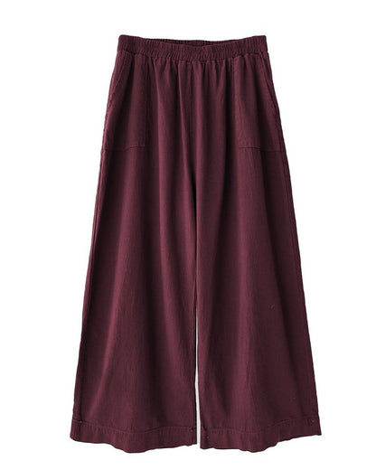 Curator atlas pant in burgundy paired with clogs and a quilted jacket