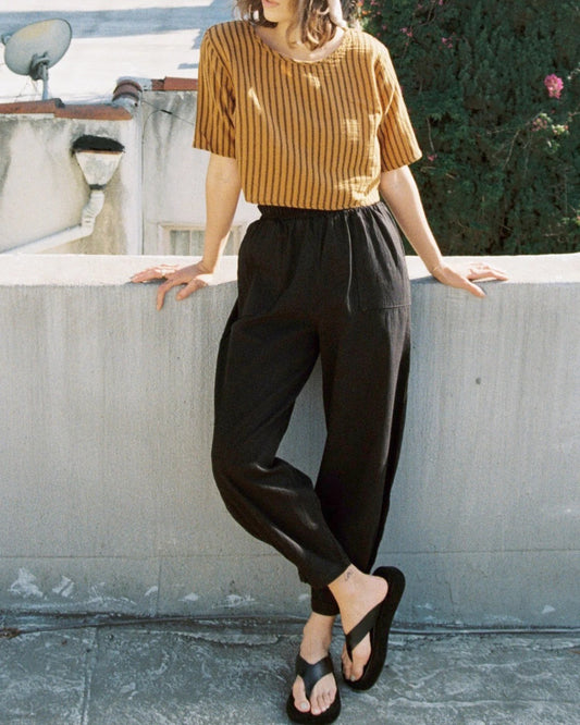 Black cotton cadence pant from Curator paired with the Hanna top in honey