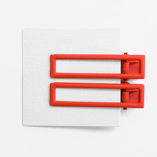 Tomato red hair clips from Nat + Noor at Clad, a sustainable clothing boutique in Asheville, NC.