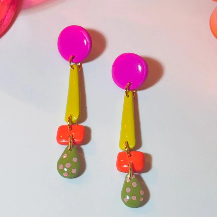 Delany and Blu pink speckled feet polymer clay earrings with pink magenta studs, chartreuse, and a pink polka dot teardrop at Clad, a sustainable clothing shop in Asheville, NC