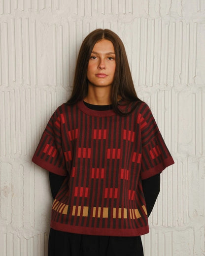 The Endery Bauhau short sleeve sweater in ruby burgundy red with olive green and dijon yellow